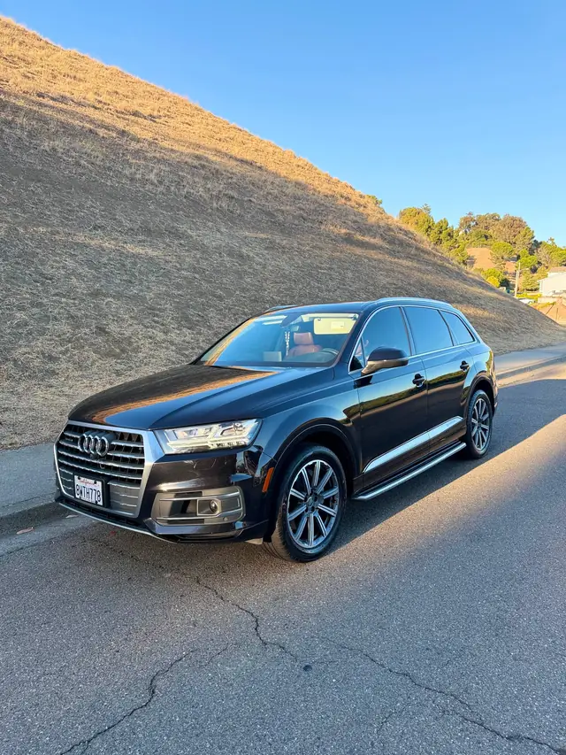 Black luxury SUV with a deep polished shine