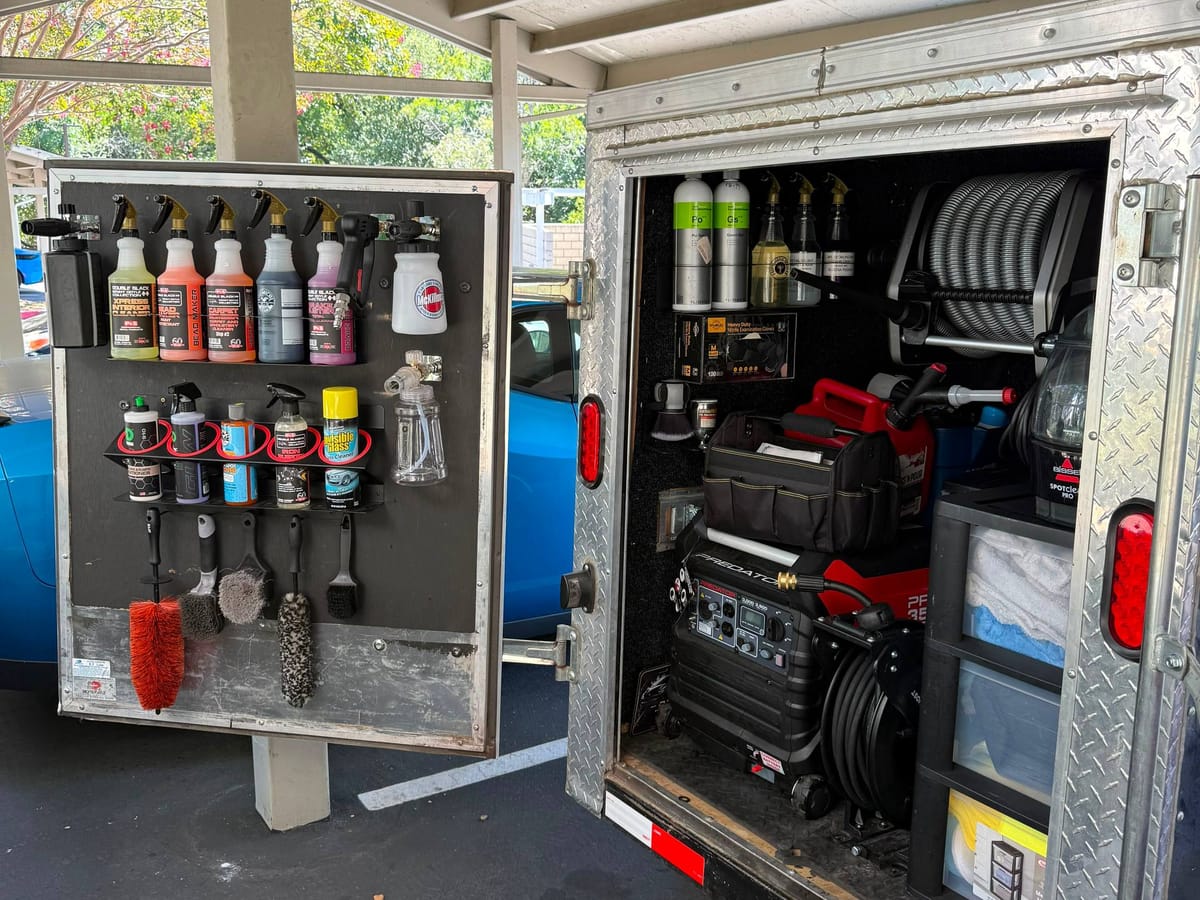 Open JBS Detailing mobile trailer organized with professional detailing products and equipment